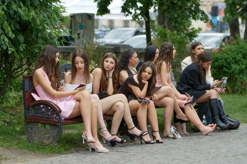 A group of girls gathered in an outdoor setting